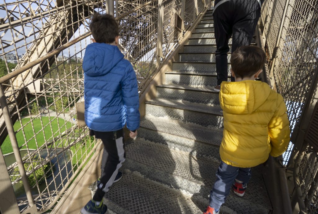 climbing the Eiffel Tower stairs with kids