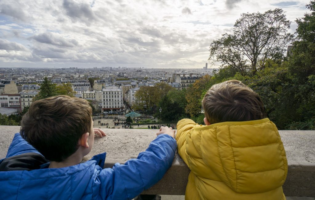 Children looking out over Paris from Montmartre hill.